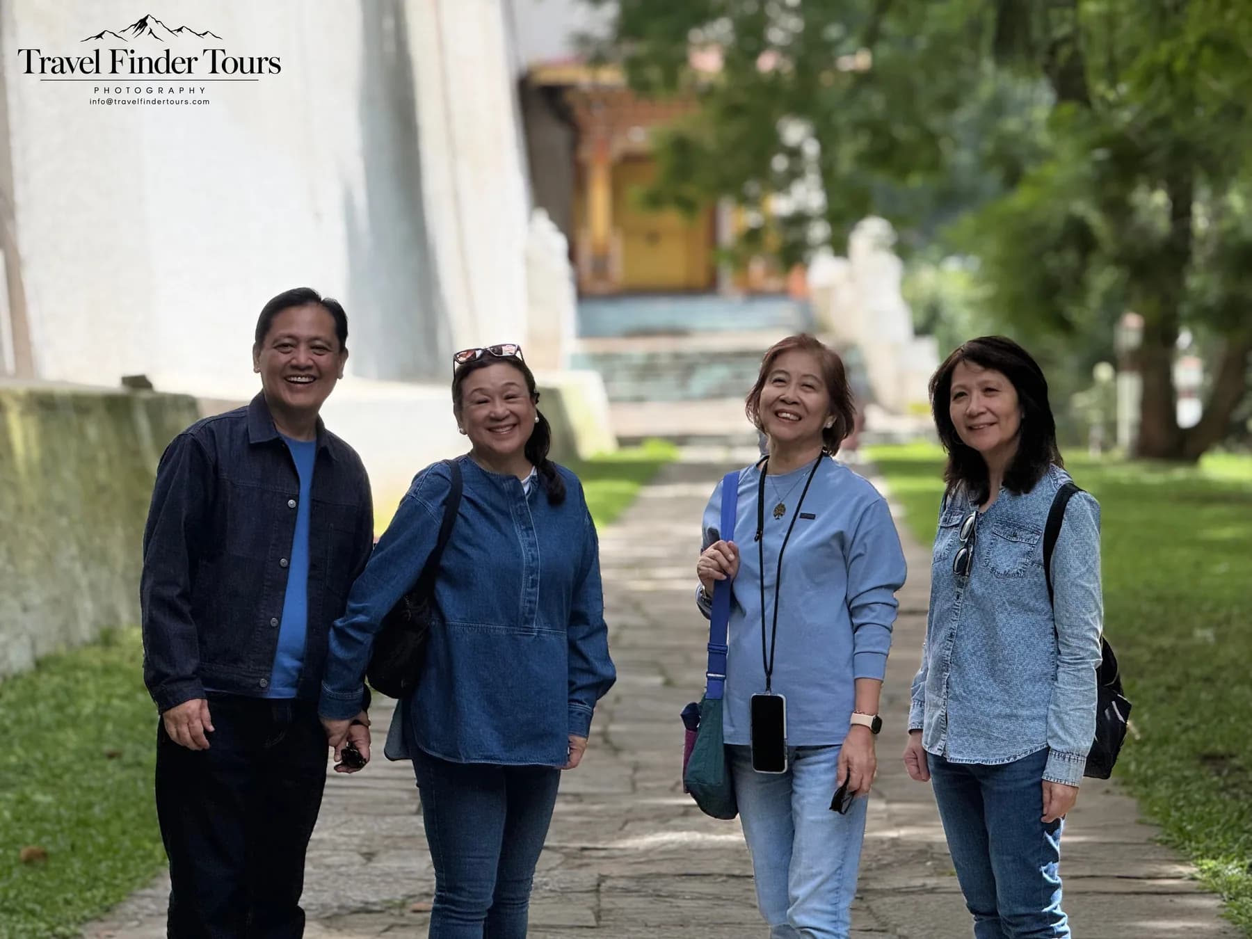 Guests standing together on a garden path