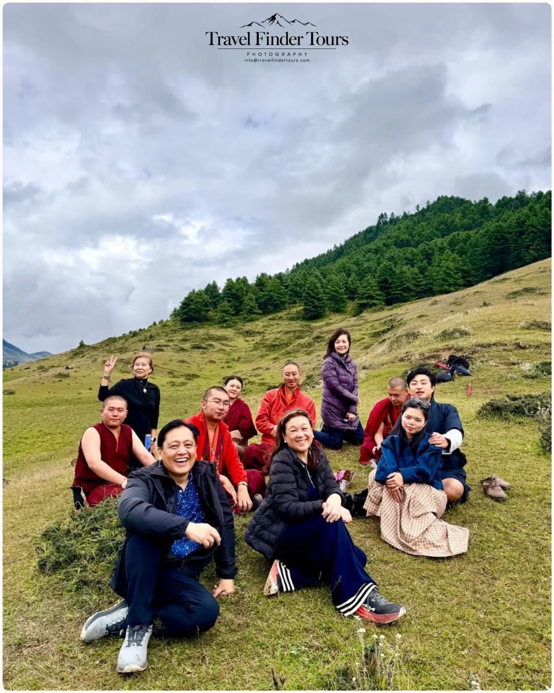A group resting on a highland hillside