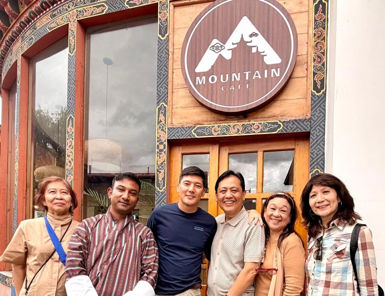 A group of guests gathered outside a local cafe
