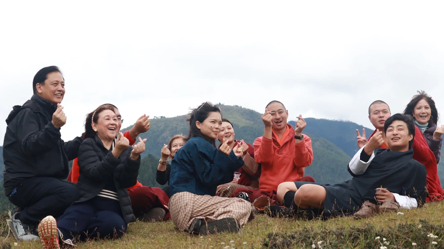 Guests sharing a meal outdoors in the mountains