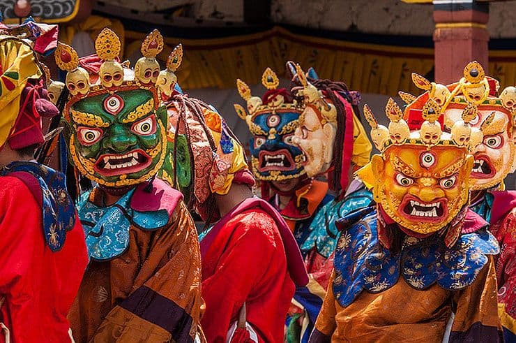 Masked deities seated during a tshechu