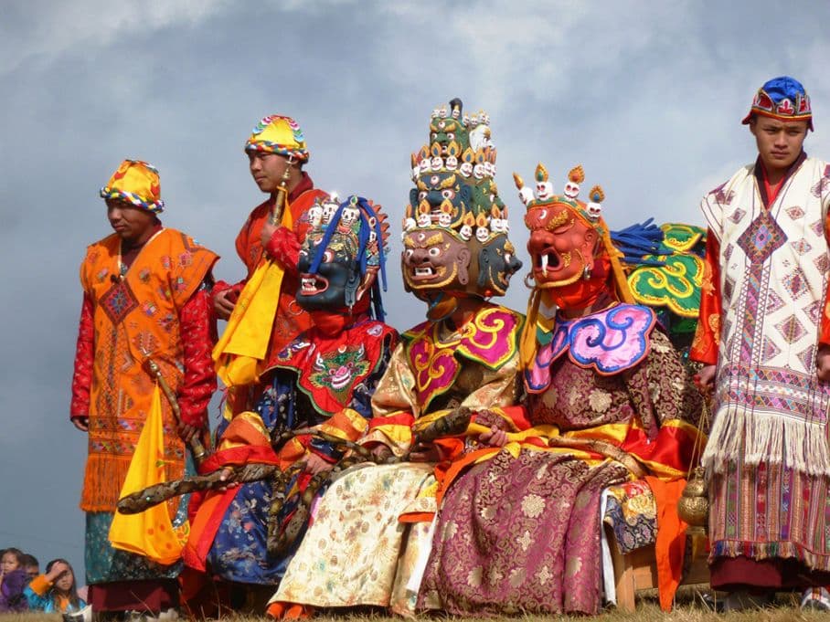 Masked skull dancers performing a cham dance