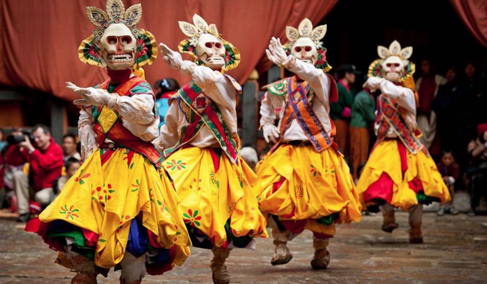 Dancer in a horned red mask at a festival